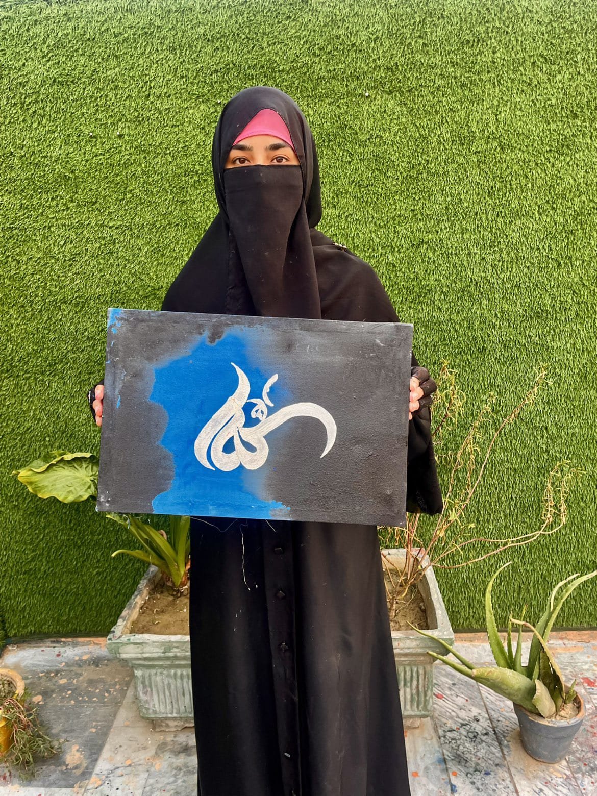 Handmade Allah Arabic calligraphy painting with white lettering on a blue and black background